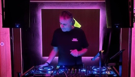 DJ performing in a small venue